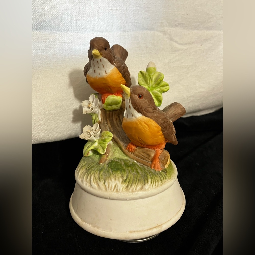 Vintage music box with robins on a branch